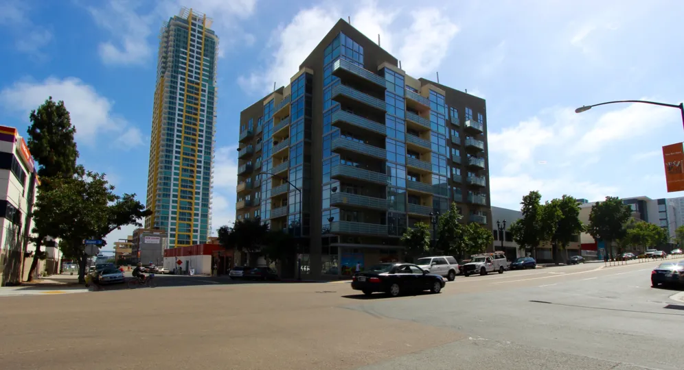 A street view of a glass building in Element community in Downtown San Diego CA.