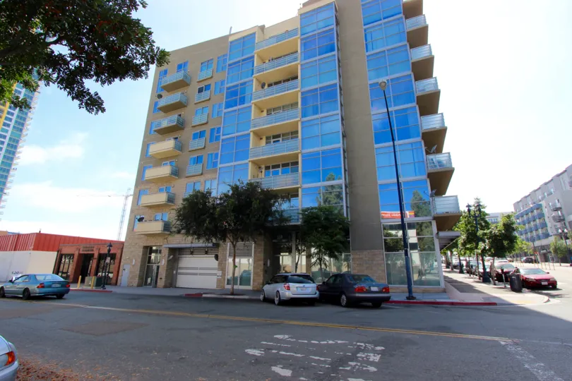 The sleek and modern building with street parking in the Element community in downtown San Diego, CA