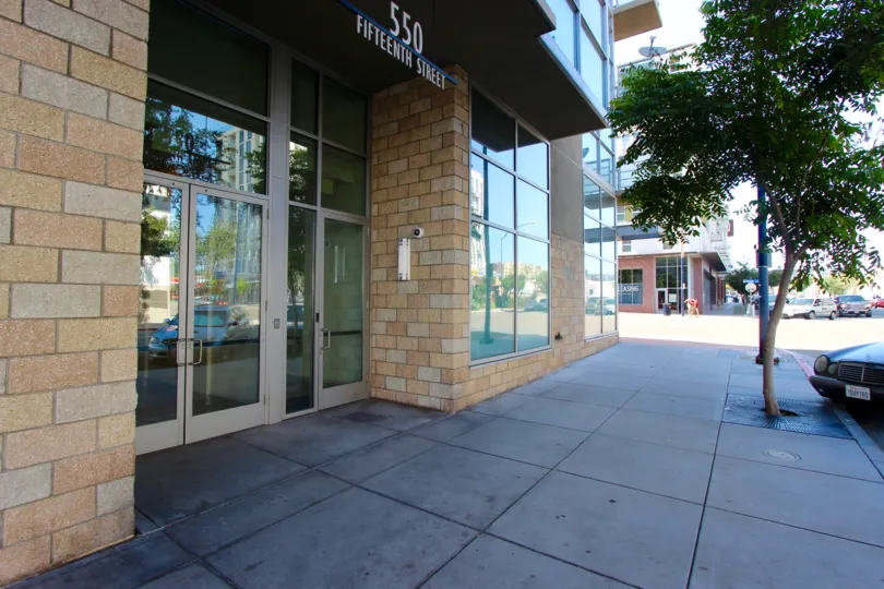 This is the front of what appears to be an urban office building where people would work. This is on Fifteenth, St.