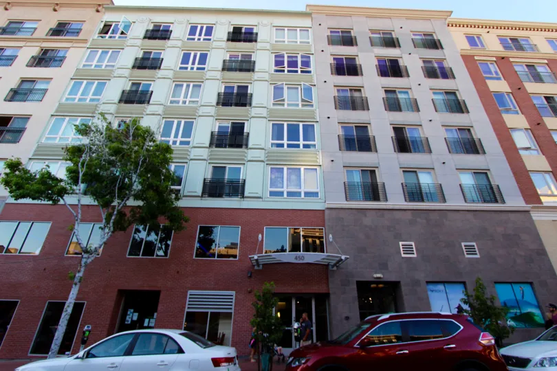 THE FALT IN THE GASLAMP CITY SQUARE WITH CAR PARKING.