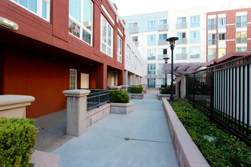 sunny day apartments nice neighborhood, lighted and fenced. many windows.