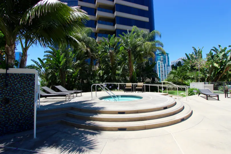 Lots of palm trees and landscaping surround the hot tub at Harbor Club.