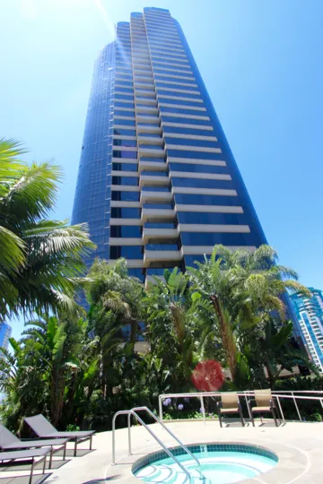 THE BUILDING IN THE HARBOR CLUB WITH COCONUT TREE, BANANA TREES.