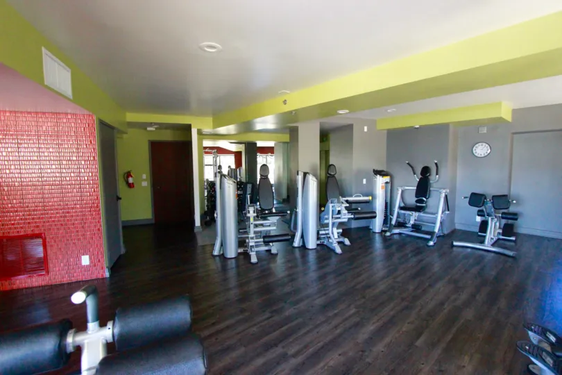 Gymnasium with equipment and wooden flooring in Harbor Club. .
