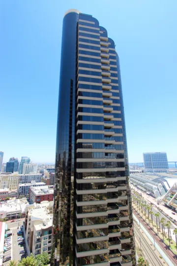 Tall glass residential high rise at Harbor Club in Downtown San Diego CA
