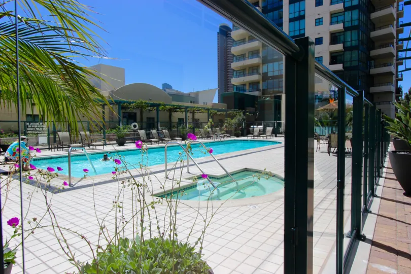 A sidewalk view of two pools in Horizons Downtown San Diego CA.