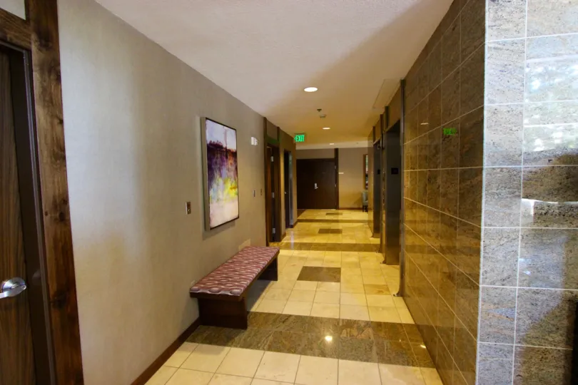 In the Horizons community in Downtown San Diego, CA a long hallway is well lit.