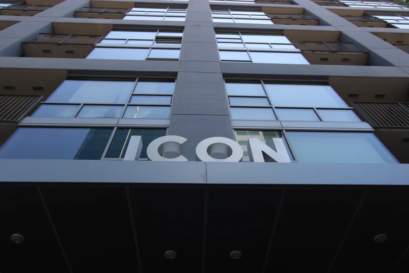 an upside picture of an Icon building with glasses at Icon