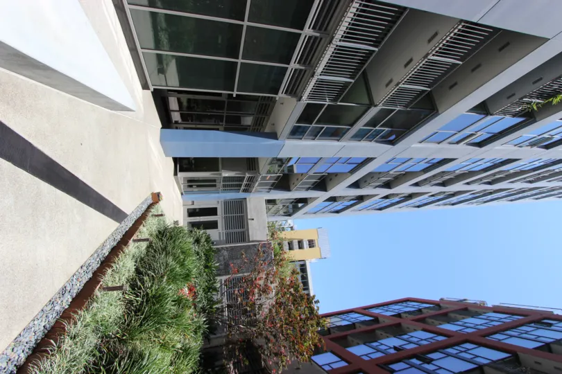 glass finished building having garden in front in Icon