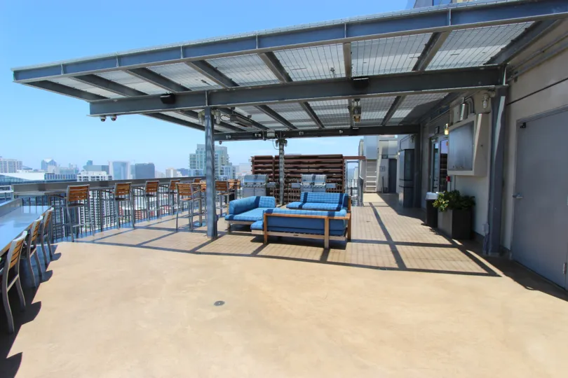 A sunny day in the area of Ico, outside, patio, covered, chairs, tables, couches, door