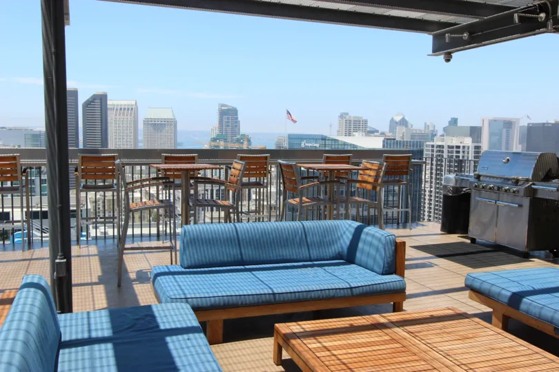 The View of the Hotel in Icon shows the city Downtown San Diego has sofa and dinning tables