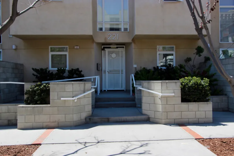 Front view of the building decorated with plants in Island Lofts