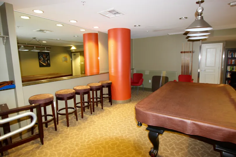 Large orange cylinder next to bar stools and a pool table at La Vita in Downtown San Diego CA