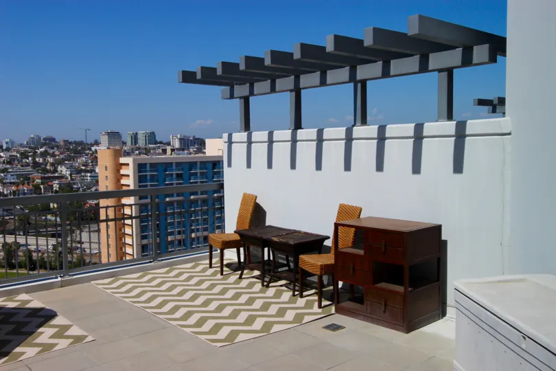 A terrace overlooking the city, some furniture in La Vita neighborhood
