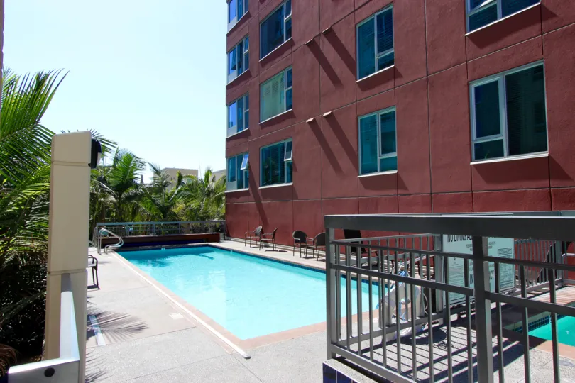 an apartment building in downtown San Diego overlooking a pool