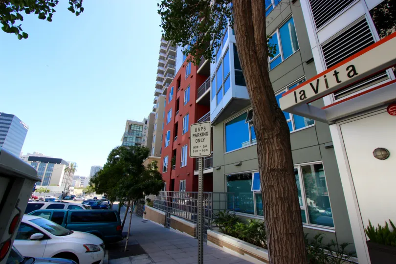 La Vita, City: Downtown San Diego, a road and cars parked, there are buildings and trees