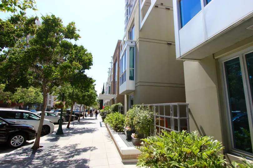 A sunny day in the La Vita with residential buildings with trees.
