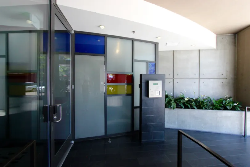 An entrance of a building in the M2i with beautiful plants.