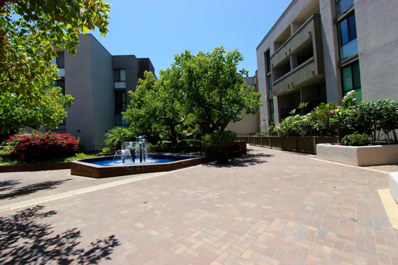 Mature landscaping, with a beautiful waterfall as a centerpoint.