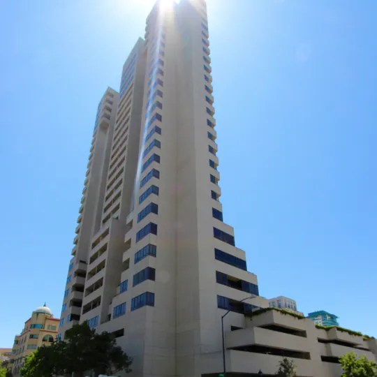 A high rise building with sun shining i the community of Meridian