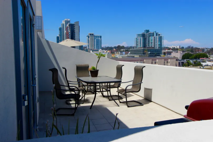in the sunny day there is a table and six chair ! beautiful landscape