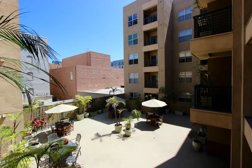 Patio below tall buildings at Pacific Terrace in Downtown San diego CA