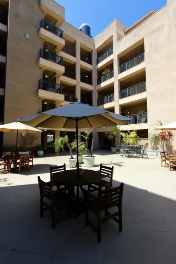 Awesome front view decorated with chairs in front of building Pacific Terrace