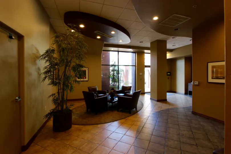 Four chairs face each other in the lobby at Pacific Terrace