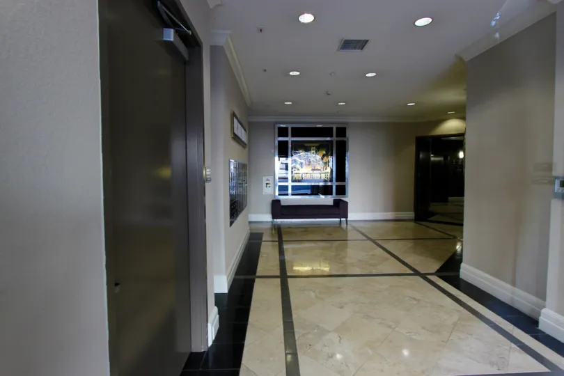 Tan and black tiles sit in a hallway at Park Blvd West.