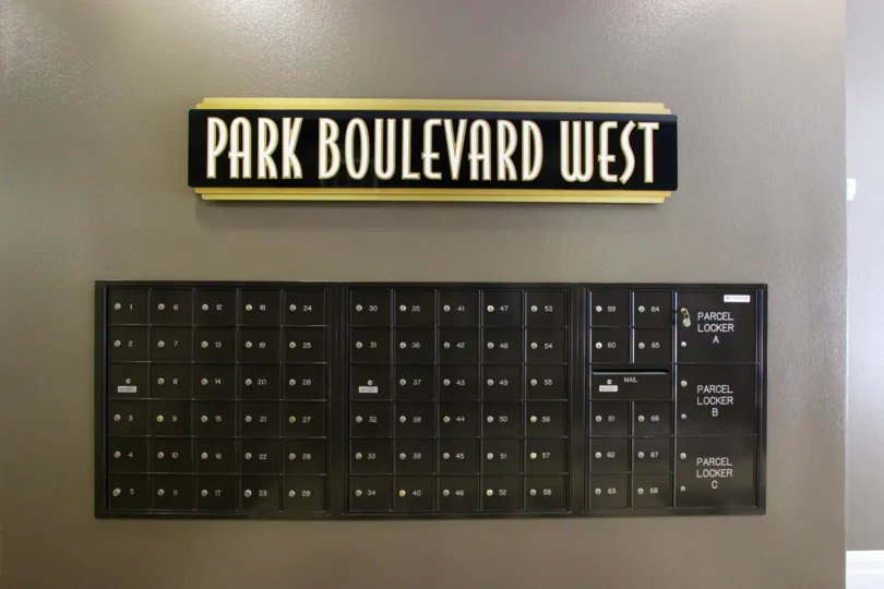Community sign above black mail boxes inside Park Blvd West at Downtown San Diego