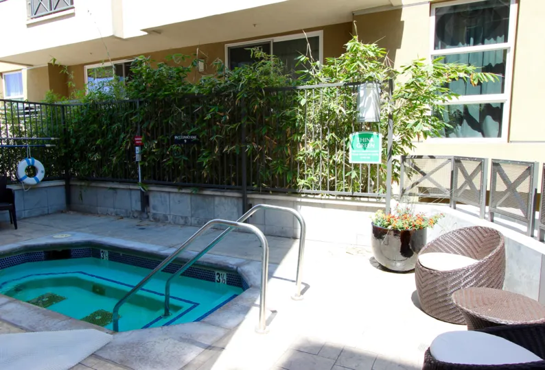 Some chairs and plants by a hot tub at Park Blvd West in downtown San Diego, CA