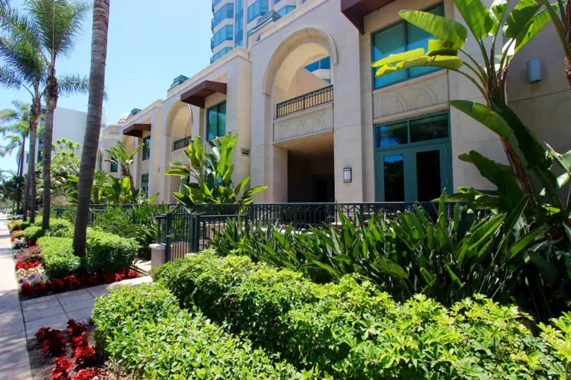 Awesome front entrance decorated with trees and plants in Park Laurel