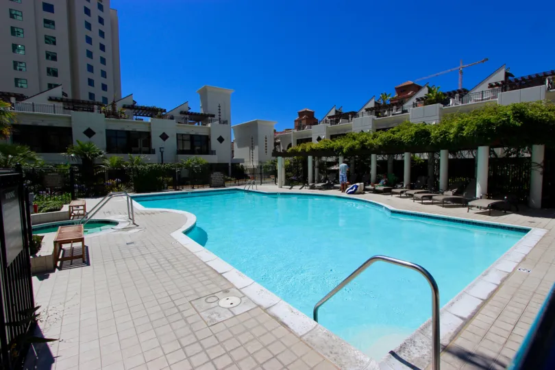 pool decorated with chair and plants in front of the building in Park Place
