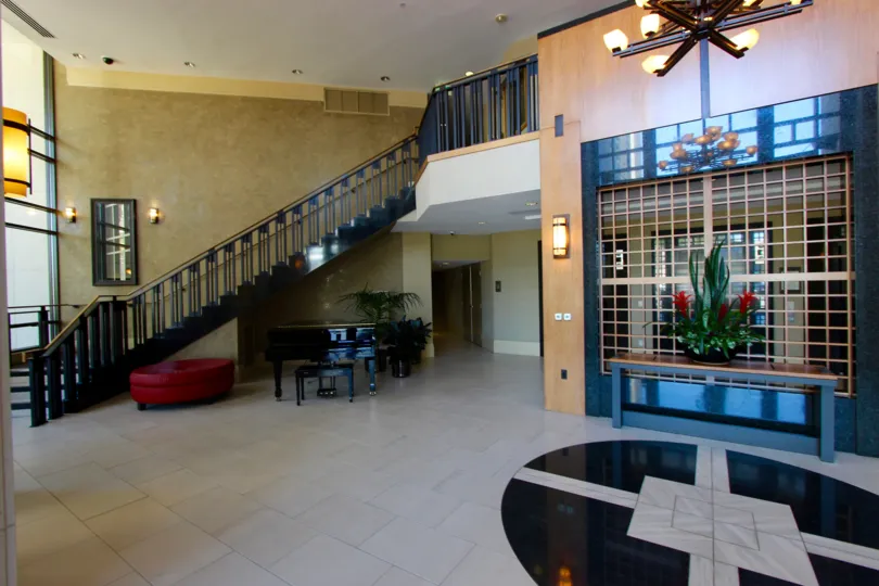 Stairway inside of a lobby with furniture inside the Park Place in Downtown San Diego CA