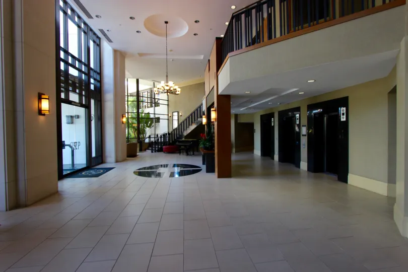 The lobby in the Park Place community with tiled floor and stairway