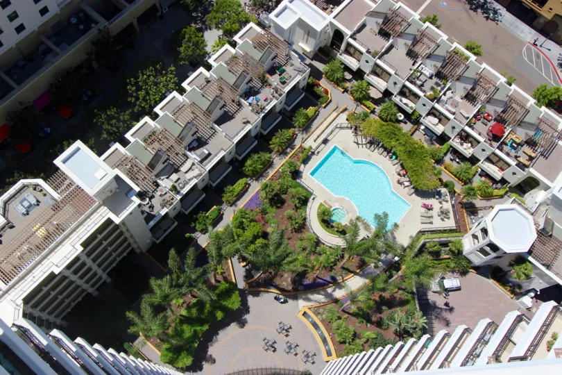 An aerial view is shown over a Park Place community pool.