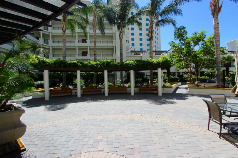 Private courtyard sourrounded by trees and topiaries at Park Place in Downtown San Diego, California
