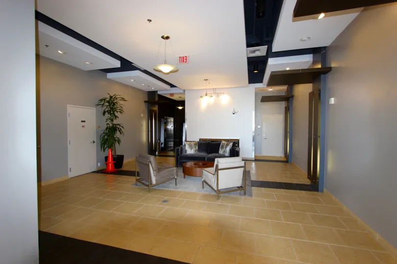 Cream color tiles and sit out are in a hall with indoor plants in Park Terrace.