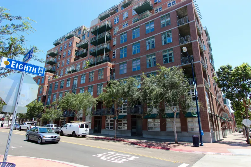 A sunny day at Parkloft apartments on Eigth Ave with beautiful trees.