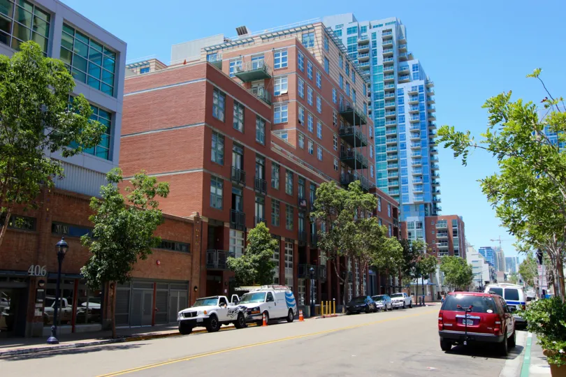Street lined with very tall buildings near Parkloft in Downtown San Diego CA