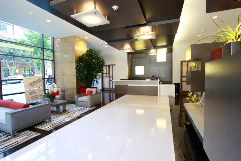 Shiny white tiles reflect the light from light fixtures at Pinnacle condos