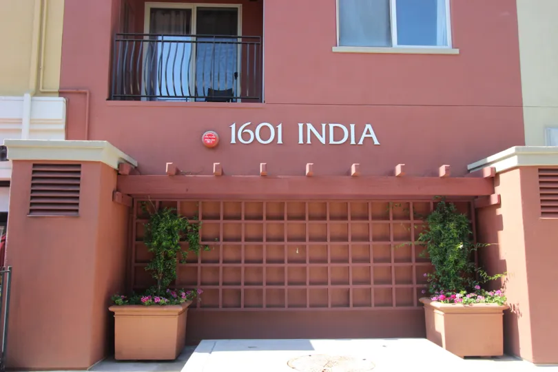 A balcony sits in the shade on a sunny day at Port Sienna