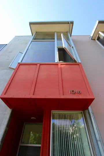 A SUNNY DAY IN THE ROWHOMES ON F WITH WINDOW'S OUTSIDE AND IT WAS OPENED