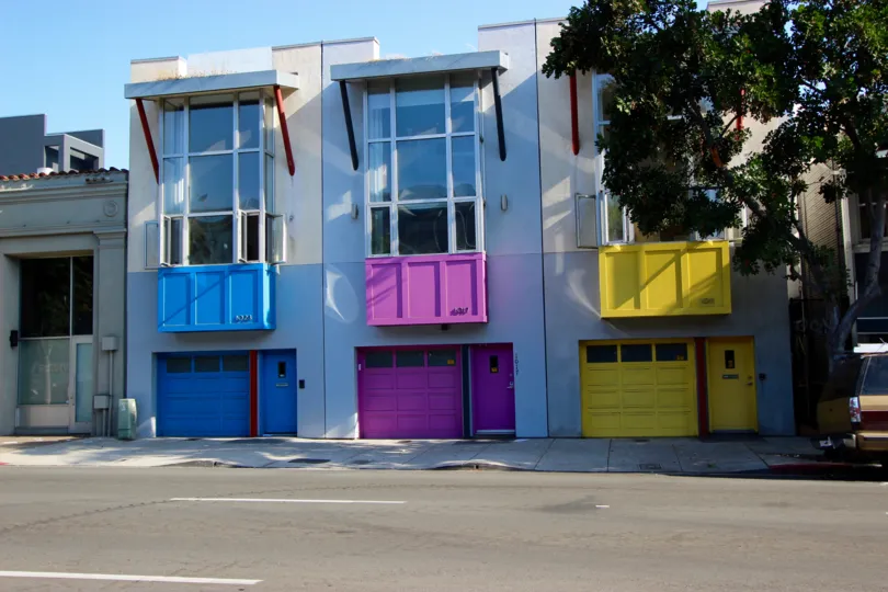 Vibrant colors welcome you to your private garage entrance at Rowhomes on F.
