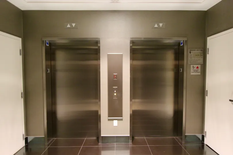 Dual stainless steel elevators in the lobby of Sapphire Tower in downtown San Diego, CA