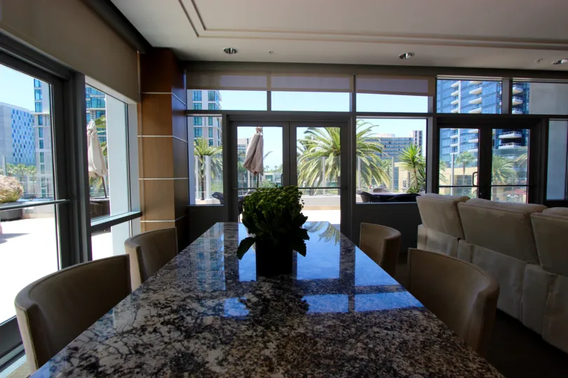 THE MEETING HALL IN THE SAPPHIRE TOWER WITH THE TABLES, ARTIFICIAL FLOWER, LIGHT.