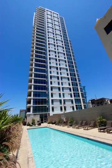Tall blue condominiums sky scraper inside Sapphire Tower in Downtown SD CA