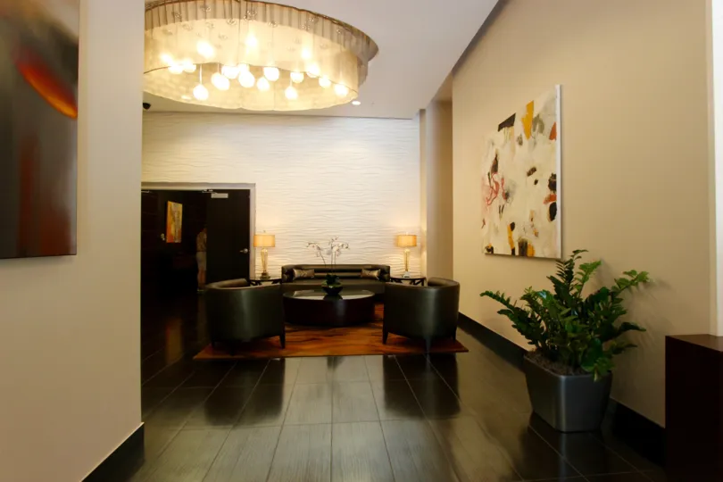 A living room in Sapphire Tower with table and chairs