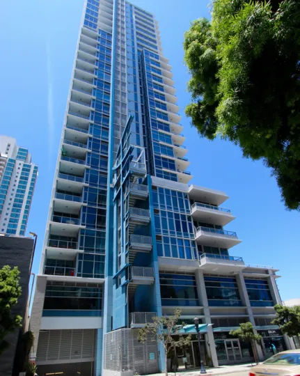 A skyscraper with with blue glasses on a sunny day with blue sly at Sapphire Tower