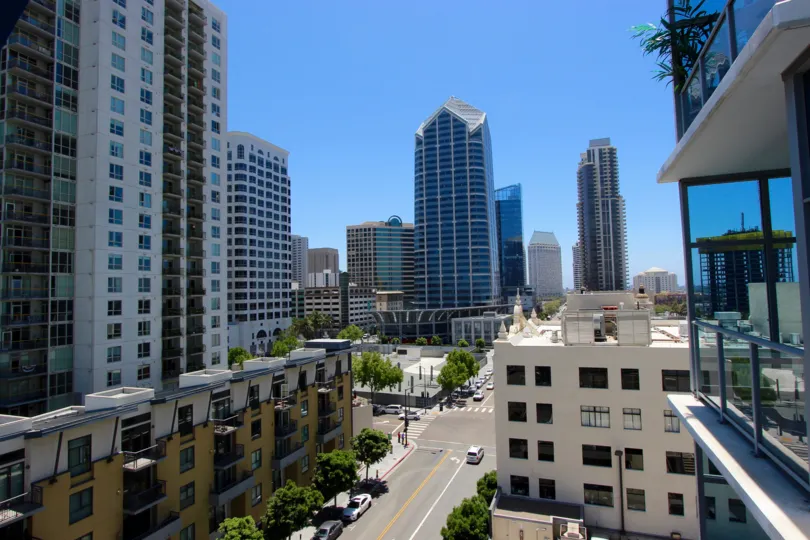 A sunny day in the area of Sapphire Tower, outside, high rise, city, street, cars